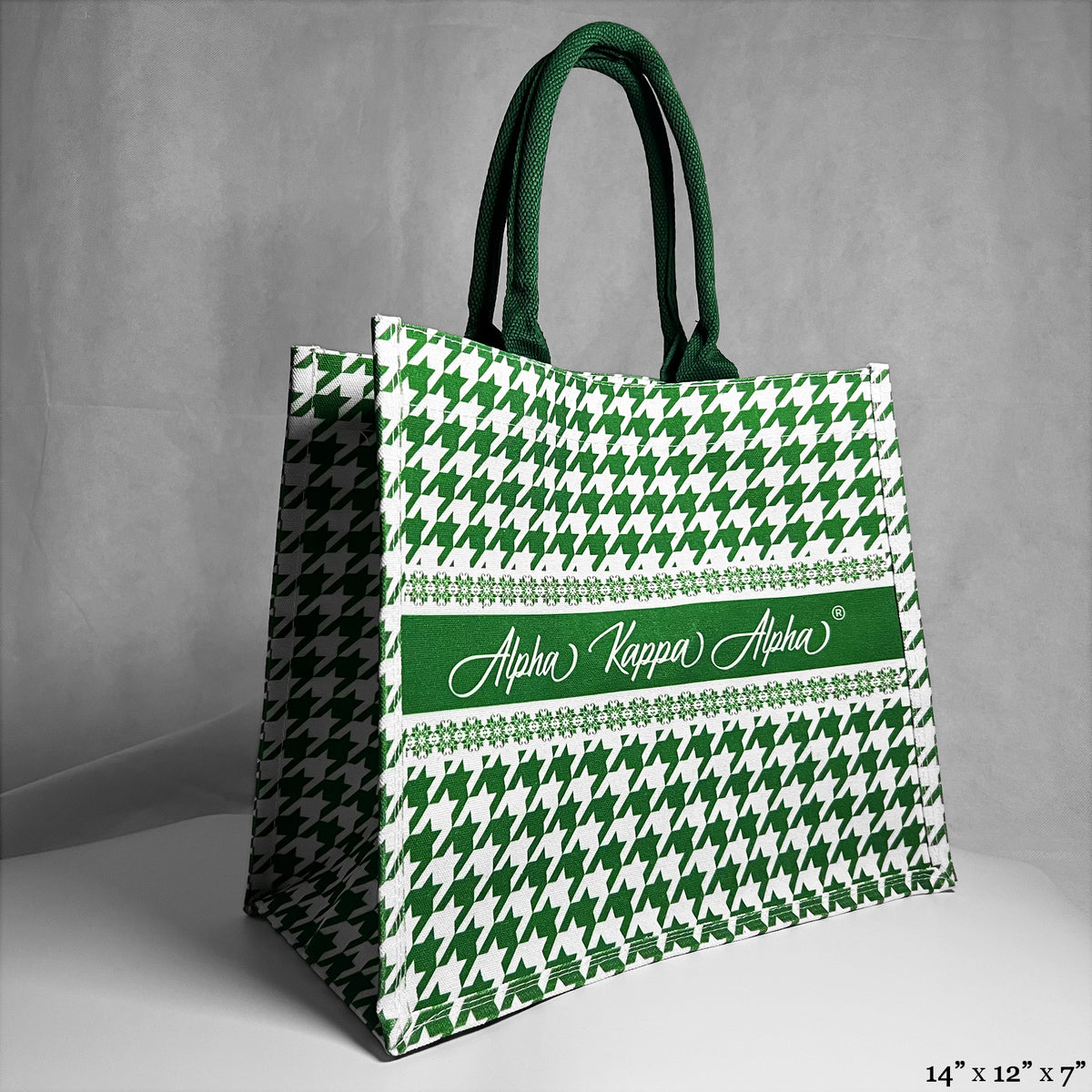 tote bag with green and white houndstooth pattern. Alpha Kappa Alpha text in the center.