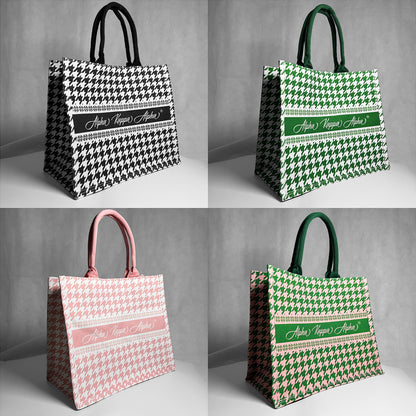 Four tote bags with houndstooth pattern and Alpha Kappa Alpha text.  Gray background