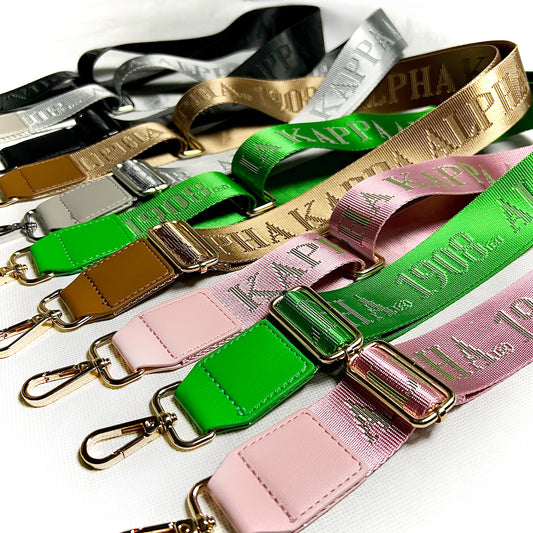Colorful bag straps with debossed 'Alpha Kappa Alpha 1908' branding on a white background