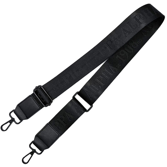 Black bag strap with debossed 'Alpha Kappa Alpha 1908' branding on a white background
