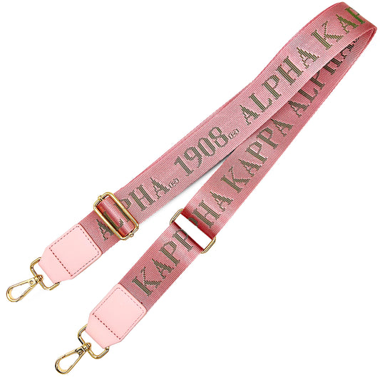 Pink bag strap with debossed 'Alpha Kappa Alpha 1908' branding on a white background