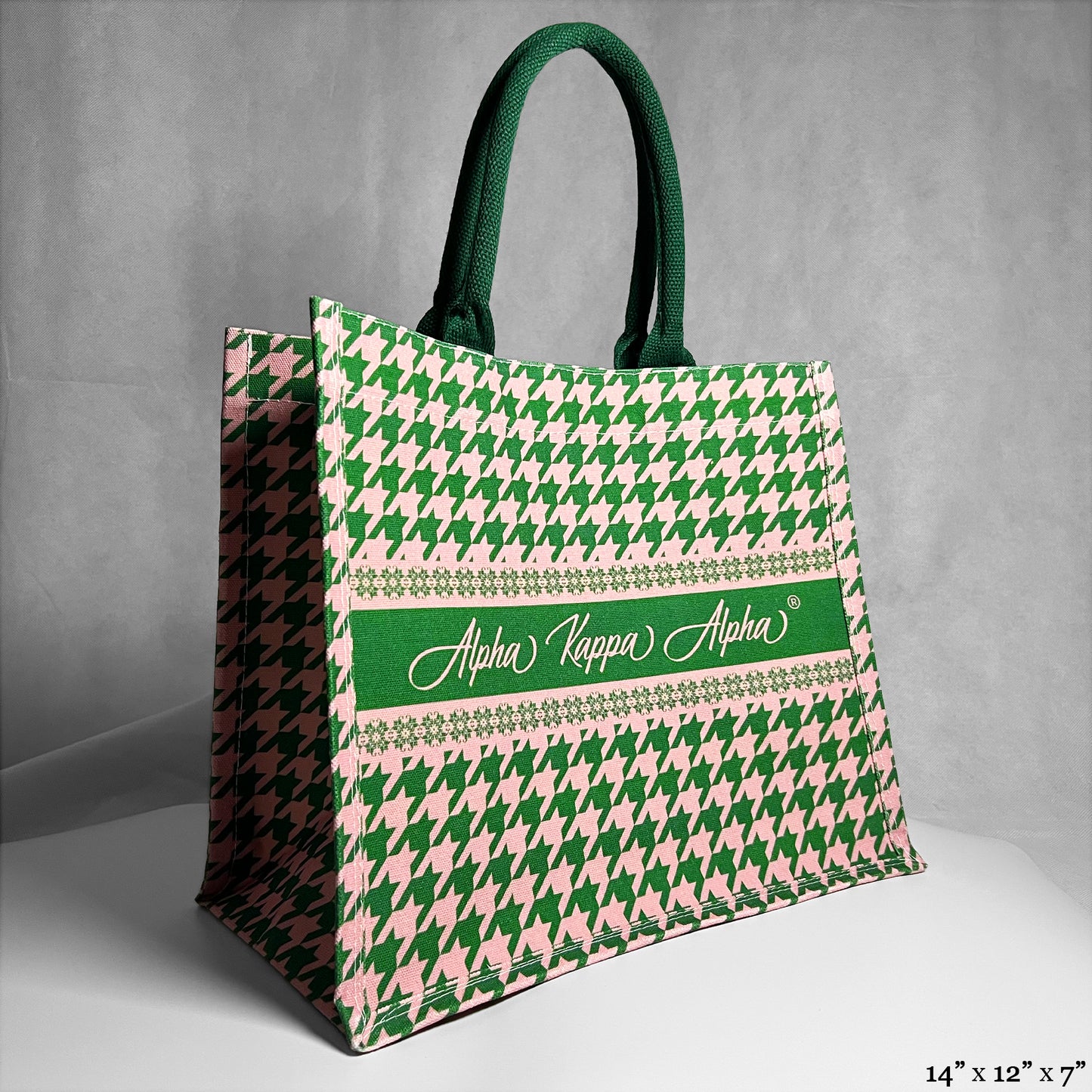Tote bag with green and pink houndstooth pattern and 'Alpha Kappa Alpha' text in the center.
