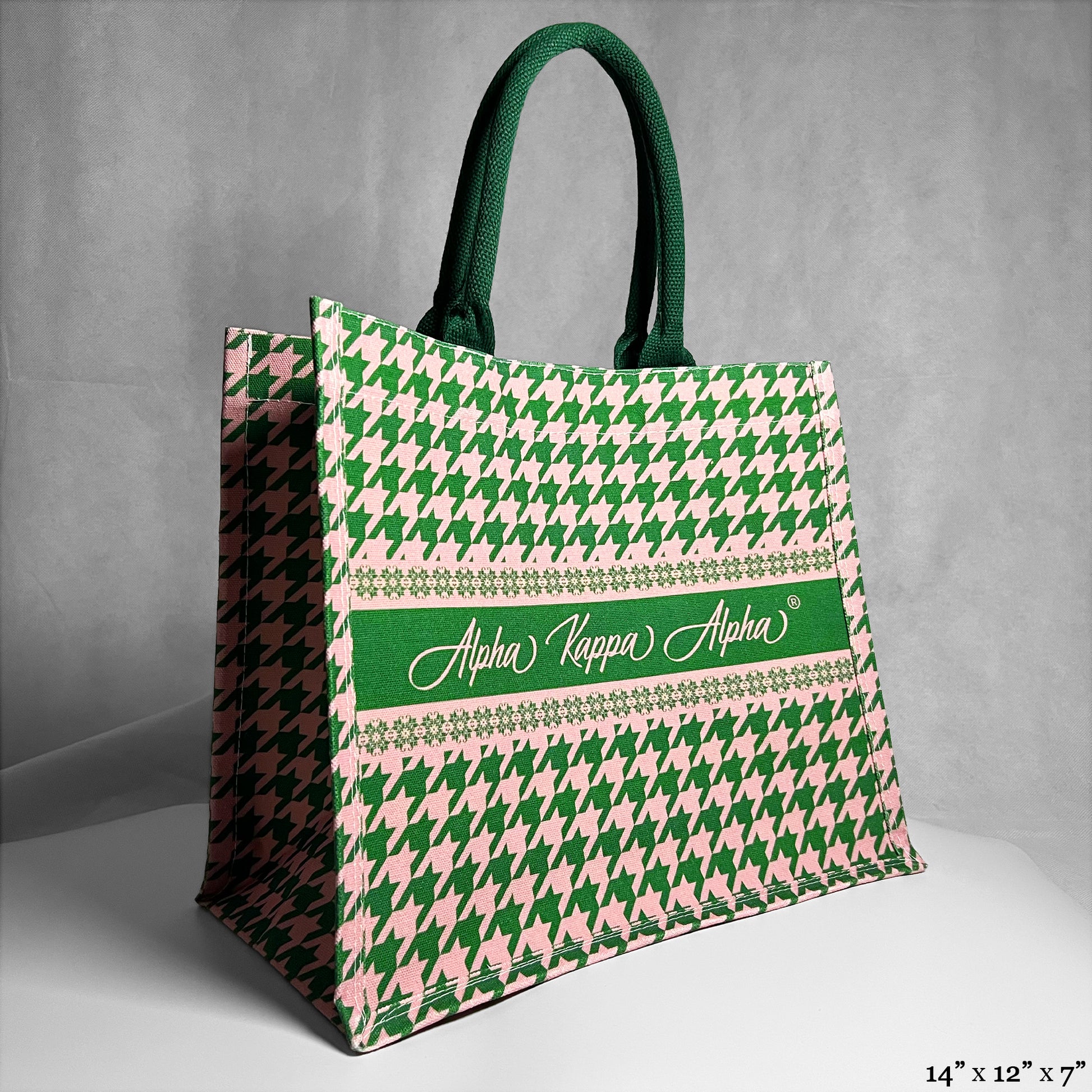 Tote bag with green and pink houndstooth pattern and 'Alpha Kappa Alpha' text in the center.