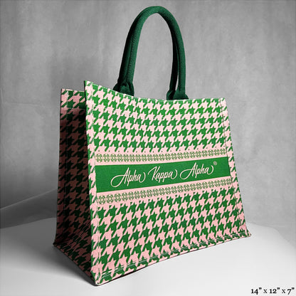 Tote bag with green and pink houndstooth pattern and 'Alpha Kappa Alpha' text in the center.