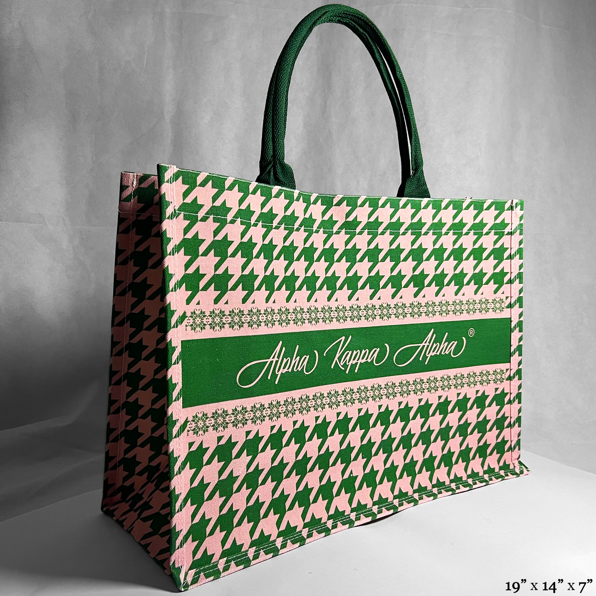 Tote bag with green and pink houndstooth pattern and Alpha Kappa Alpha text in the center.