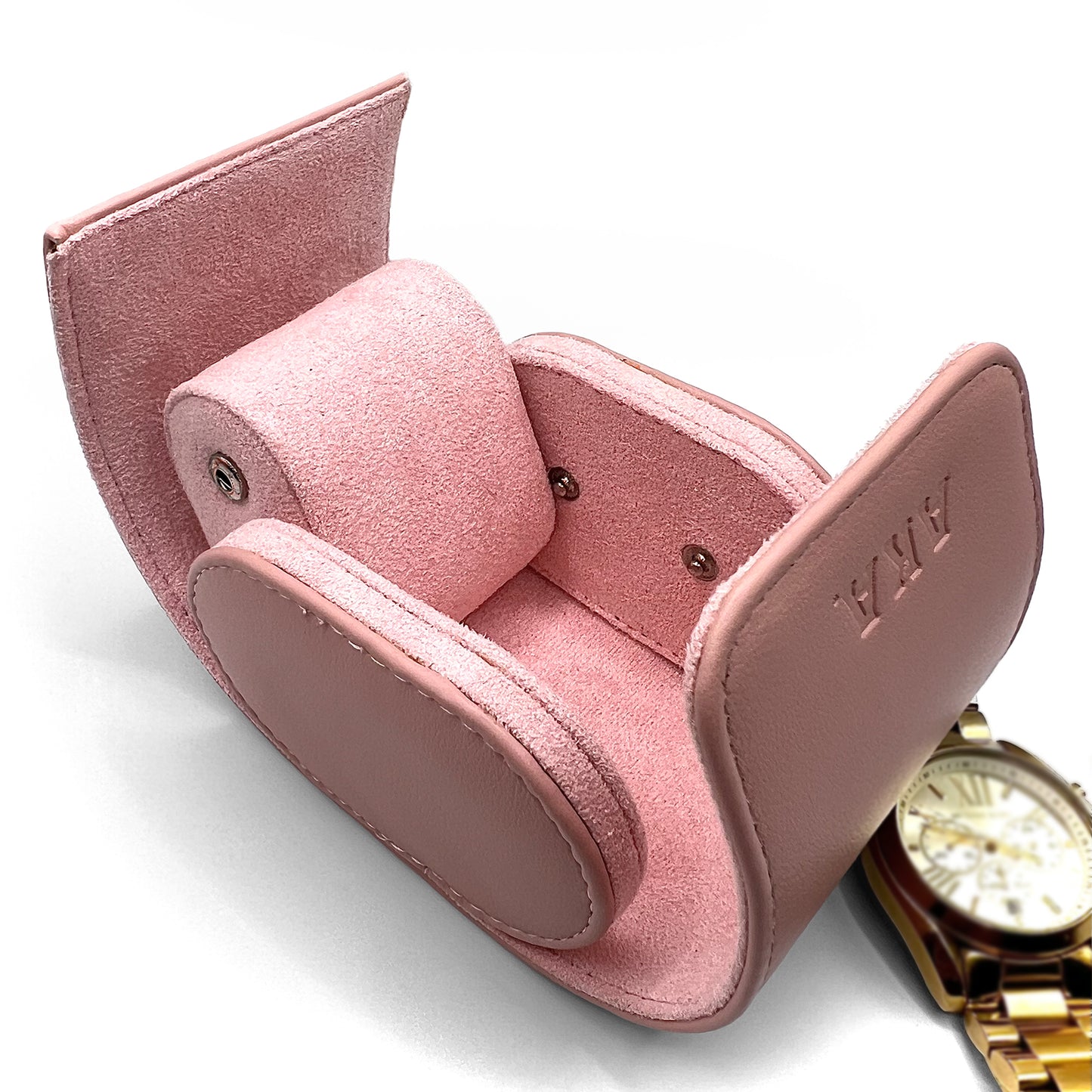 Pink jewelry box with a gold watch on a white background