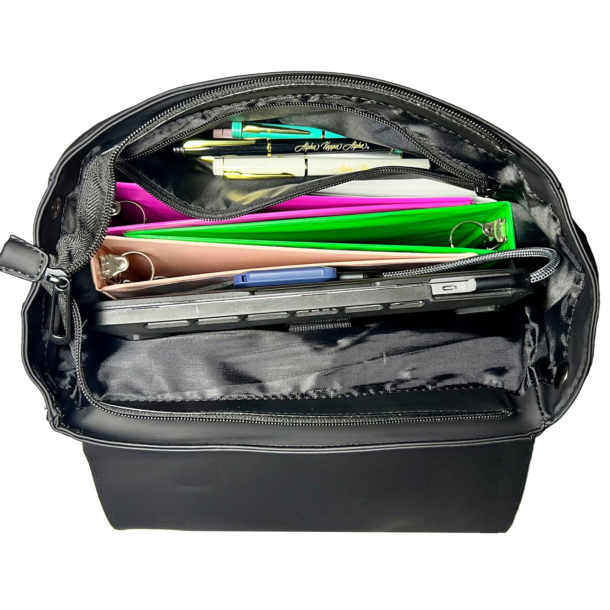 Open-top view of backpack, showcasing the space inside. Backpack is holding 3 binders, 2 notebooks, several pens in a zipper pocket, and a 17 inch laptop in the padded laptop section.